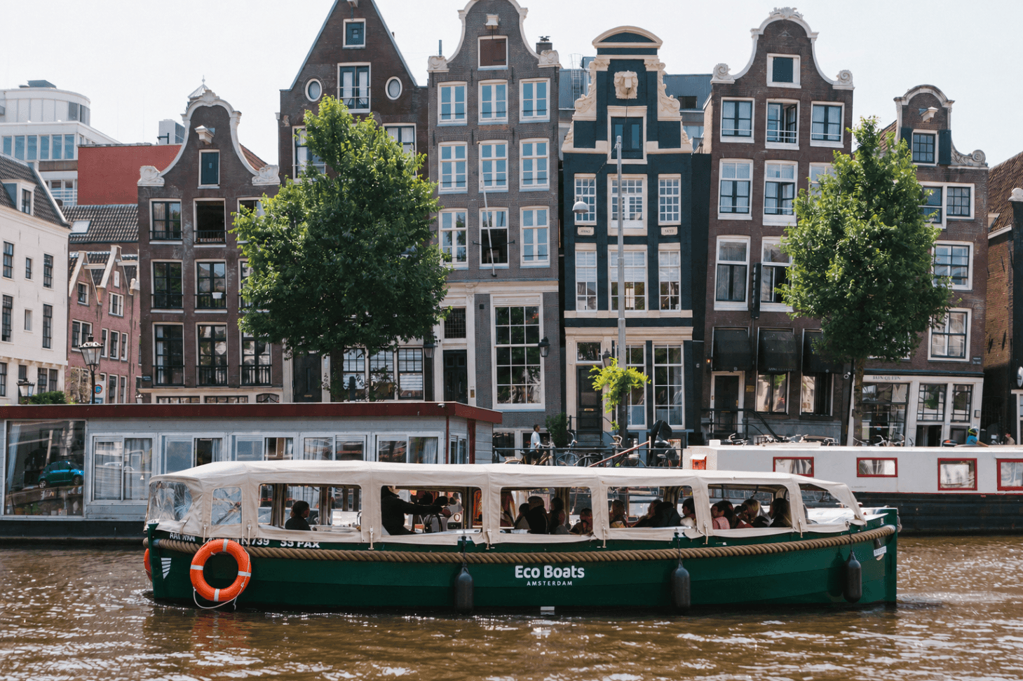 private boat with pizza in amsterdam